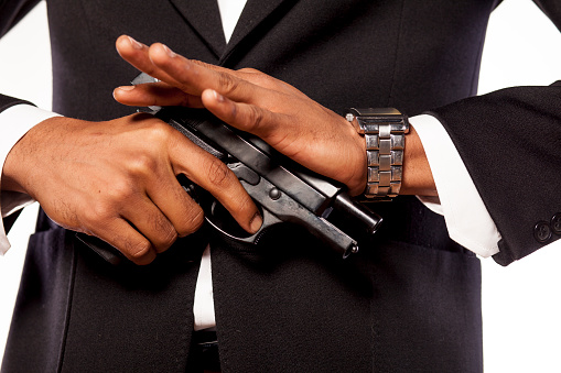 African businessman recharging his gun