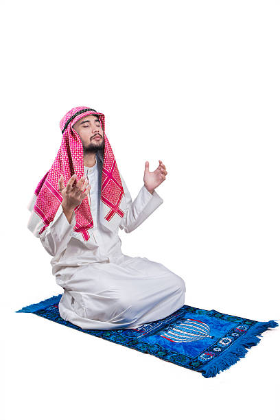 istock Arabian man sits on the carpet and praying 532103932