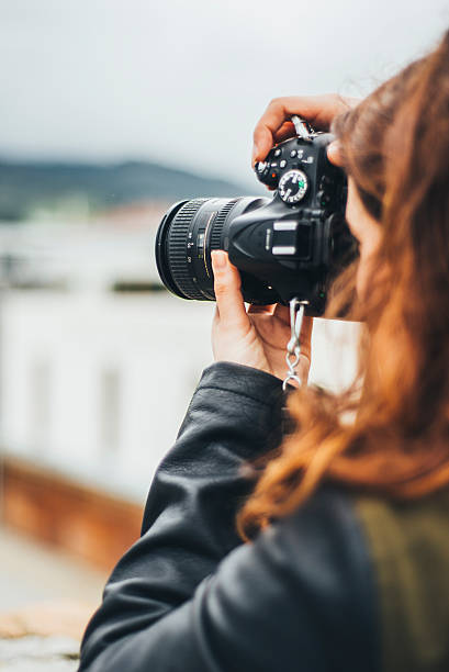 istock Young female photographer 532104378