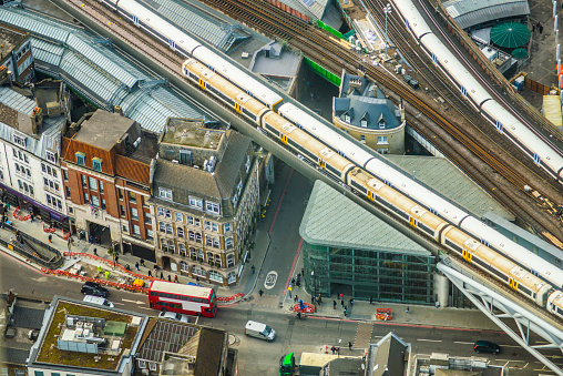 Trains and traffic in the city centre of London, England. Aerial view