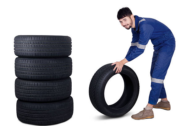 istock Arabic mechanic pushing a tire 532108334