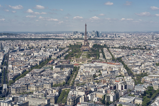 A photo of cityscape with Eiffel Tower. Aerial view of the central district of Paris. It is one of the most famous tourist attraction in France.