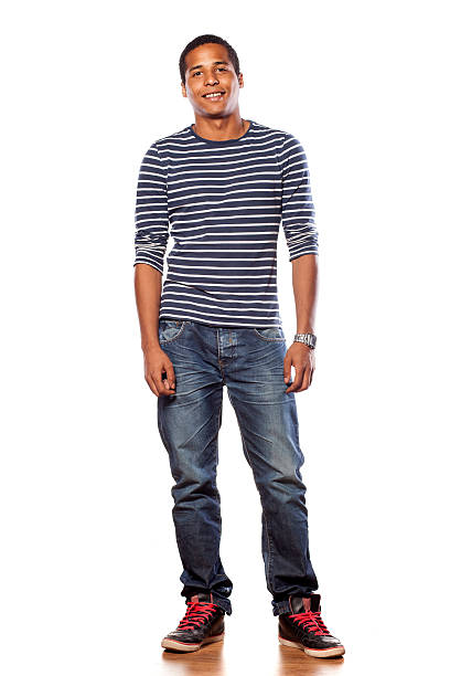 istock Smiling dark-skinned young man in jeans and a blouse 532111865