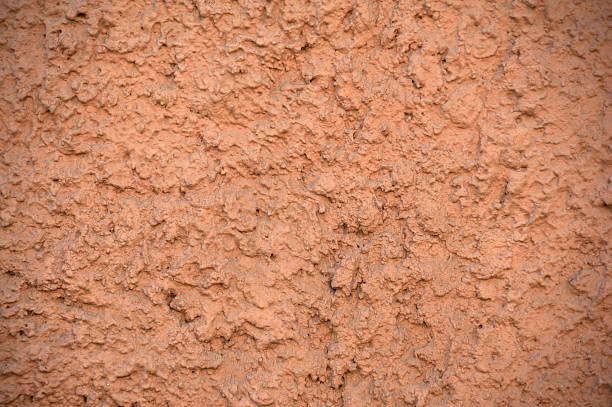 istock Texture of old wall covered with brown stucco 532112256