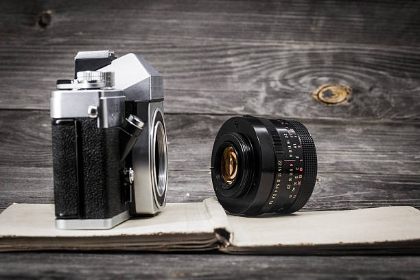 istock old camera at  vintage book, wooden background 532112322
