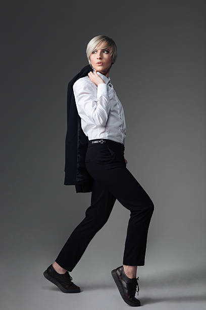 istock Stylish woman posing with jacket on her shoulder 532112514