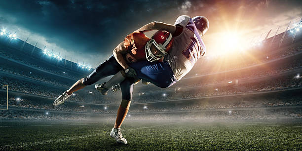 istock American football player being tackled 532112550