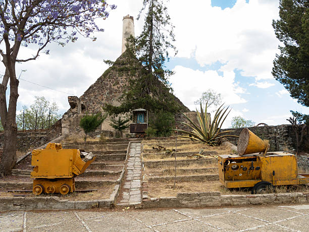 Guanajuato, Mexico - April 22, 2014: A shrine to the Virgin and old mining equipment in the silver mine of Valenciana, now a museum.