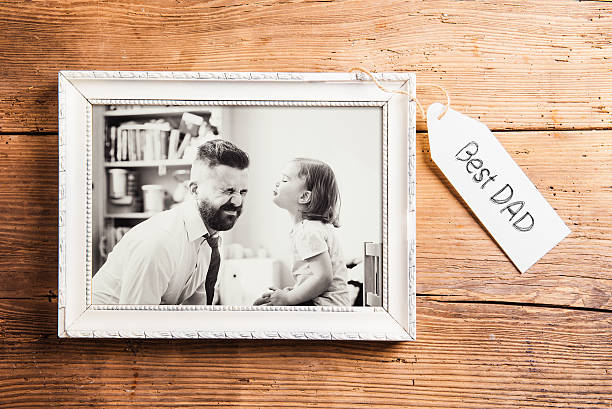 istock Fathers day composition. Picture frame. Wooden background. 532113864
