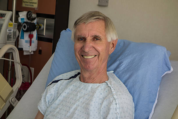 istock Mature Man Smiles From His Hospital Bed 532114893