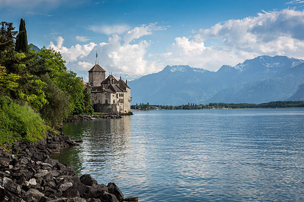 Montreux, Switzerland - June 5, 2013: Chateau Chillon, Montreux, Switzerland.  The Chateau de Chillon (Chillon Castle) is located on the shore of Lake Leman, at the eastern end of the lake, 3km from Montreux, Switzerland. The castle consists of 100 independent buildings that were gradually connected to become the building as it stands now.