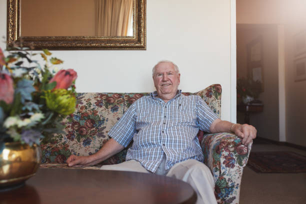 istock Happy senior man sitting relaxed on a couch 532123090