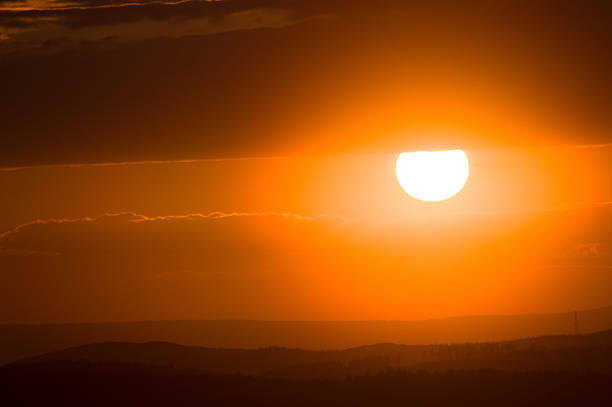 istock orange disc of the sun at sunset sky 532123190