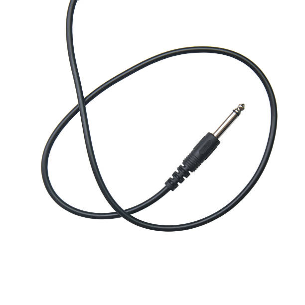 istock Guitar audio jack with black cable isolated on white background 532124728