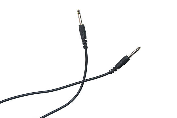 istock Guitar audio jack with black cable isolated on white background 532124748