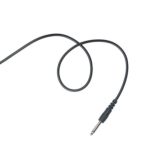 istock Guitar audio jack with black cable isolated on white background 532124926