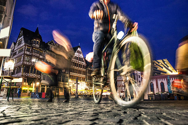istock Cyclist in Frankfurt old town at night 532127396