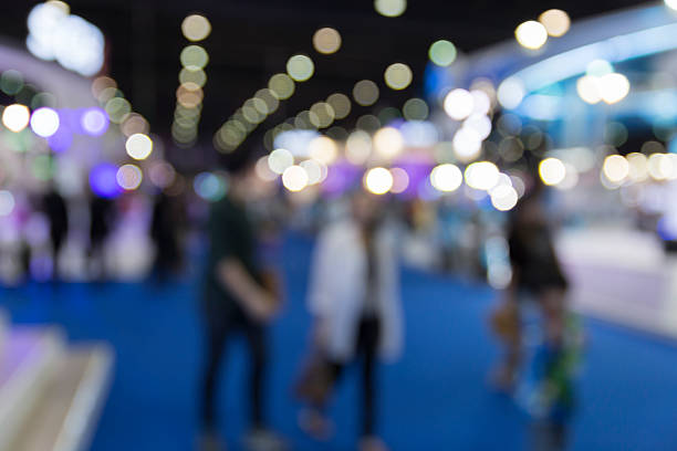 istock people in exhibition hall building, blur background 532127458