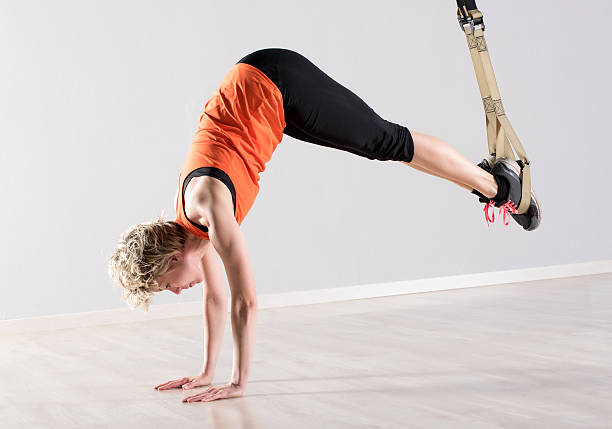 istock Woman on hands with training rings around feet 532128438