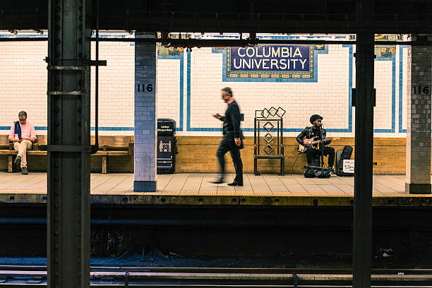 New York, USA - May 11, 2016: People waiting the train at the Columbia University station (116th St.) This picture was taken a weekday after class hours.