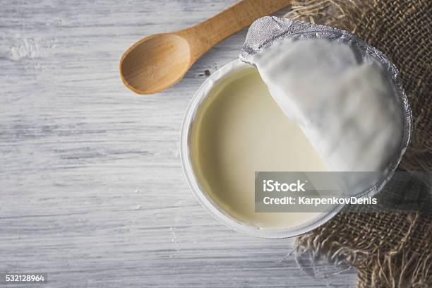 Natural Yogurt On The White Wooden Table Top View Stock Photo - Download Image Now - Dairy Product, Food, Food and Drink