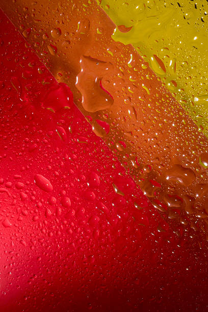 water drops on glass bright abstract background of water drops on glass reflectivity stock pictures, royalty-free photos & images