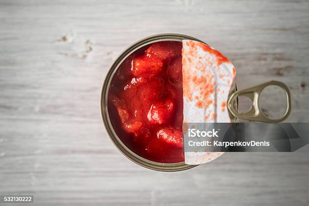 Chopped Tomatoes In Metal Can In Wooden Table Top View Stock Photo - Download Image Now