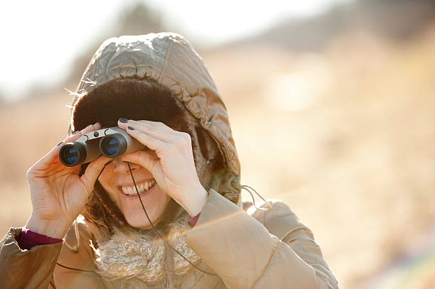 istock Woman with a Binocular Watching Around 532130387