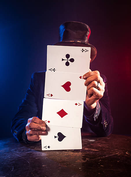 istock Senior man making trick with playing cards 532130455