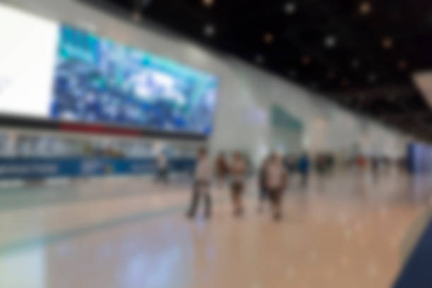 istock people in exhibition hall building, blur background 532130984