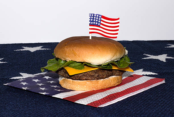 istock Hamburger on an American flag napkin with a flag toothpick 532131224