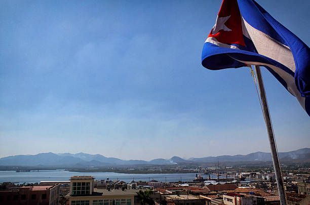 istock cuban flag waving with santiago in the background 532131801