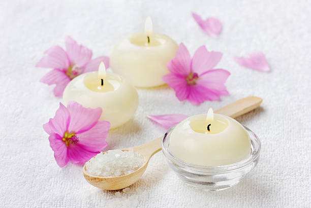 istock sea salt bath, pink flowers and burning candles 532132795