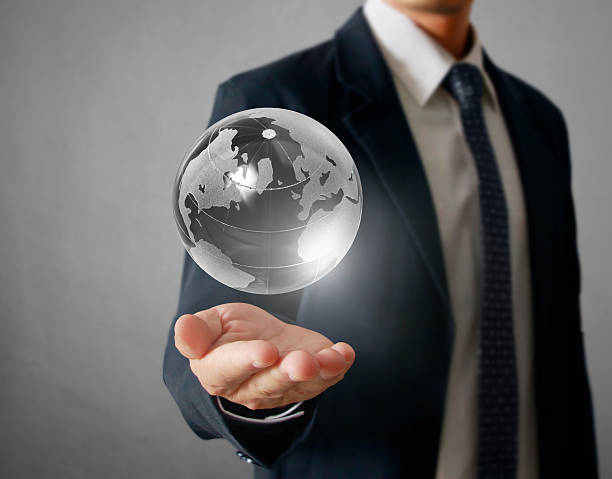 istock holding a glowing earth globe in his hands 532132813