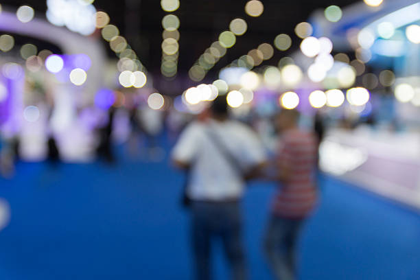 istock people in exhibition hall building, blur background 532132964