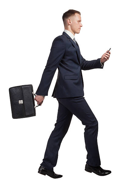 istock Running businessman with his briefcase and mobile phone on white 532134228