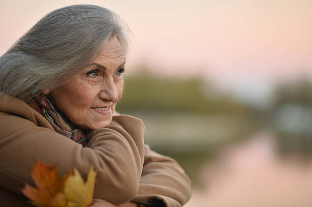 istock senior Woman near river 532134524