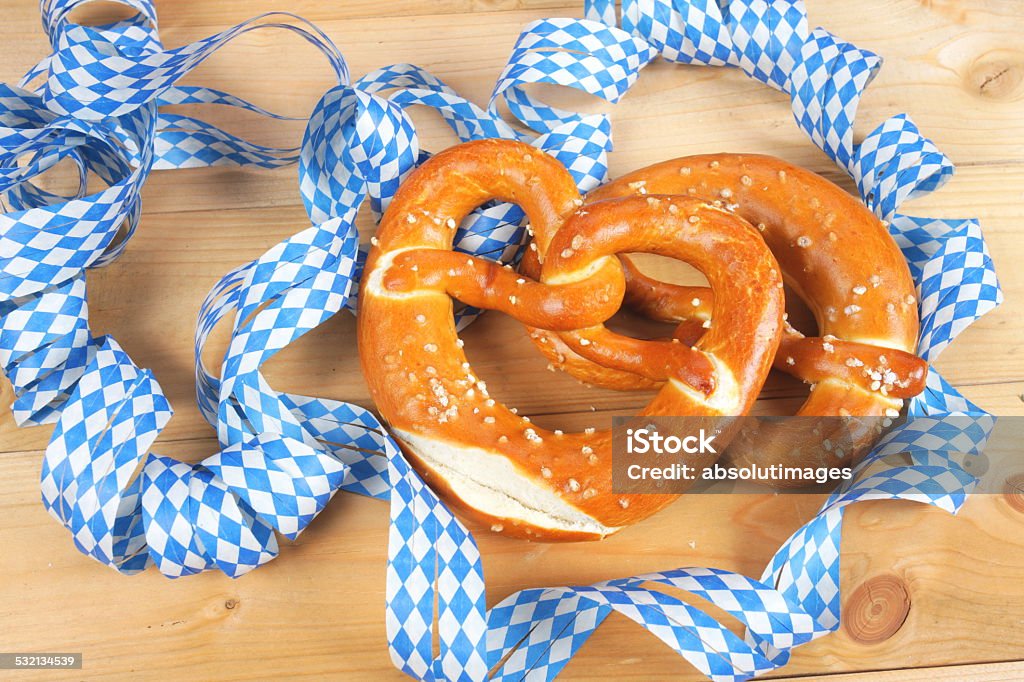 Salty pretzels on wooden board Salty bavarian pretzels on wooden board 2015 Stock Photo