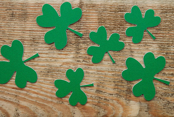 istock Green clovers or shamrocks on rustic wood background 532135010