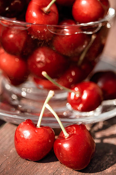 Close-up of two fresh red cherries. stock photo