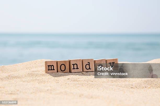 Monday Word On Sunny Beach Stock Photo - Download Image Now - Monday, Single Word, 2015