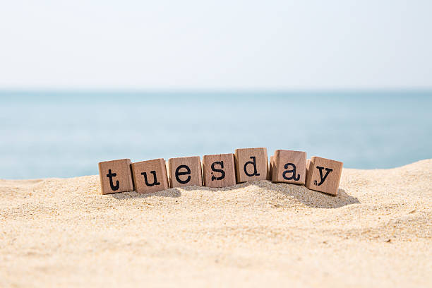 istock Tuesday word on sea beach 532136907