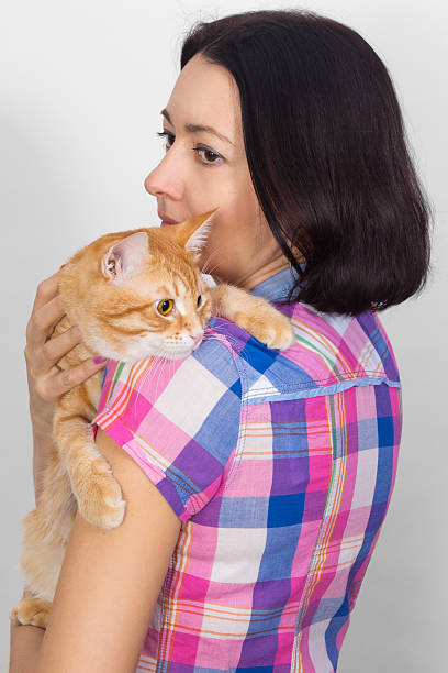 istock Woman with cat on his shoulder 532150119