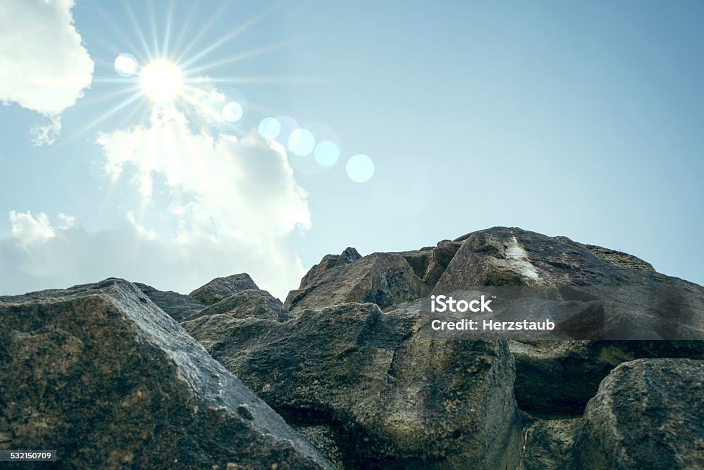 Top of the mountain A rock facing upwards in the sky 2015 Stock Photo