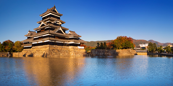Matsumoto, Japan - October 28, 2014: The wooden castle of Matsumoto was completed in the 16th century and is Japan's oldest castle. The building is also known as 'Crow Castle' for it's black exterior.
