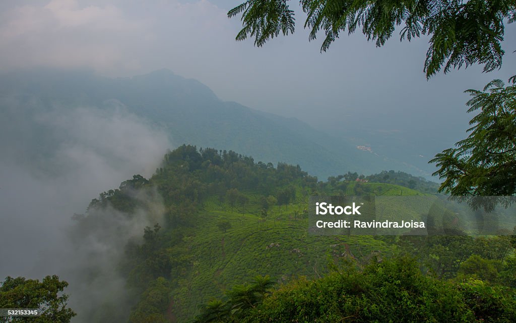 Cloud covered mountain peaks Top view of the western ghats rain forest in south India. 2015 Stock Photo