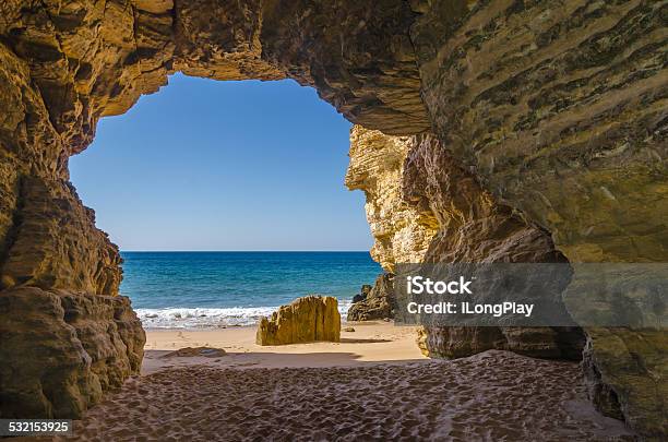 Cave At Beliche Beach Stock Photo - Download Image Now - Beach, Hiding, Cave