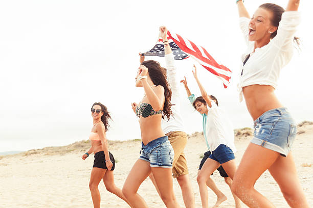 istock Happy friends celebrating on the beach 532164320