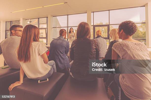 Group Of Students At The Lecture Stock Photo - Download Image Now - Rear View, Sitting, Tutor