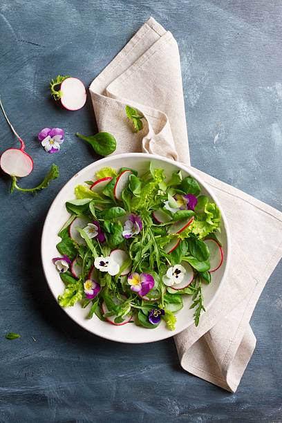 istock Spring salad with radishes, edible flower and sauce 532169406